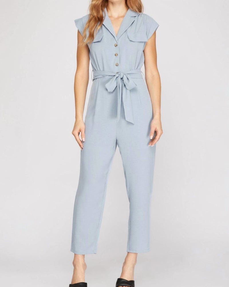 Front of a model wearing a size Large Dolman Sleeve Flap Pocket Belted Jumpsuit In Light Blue in Light Blue by SHE + SKY. | dia_product_style_image_id:350570